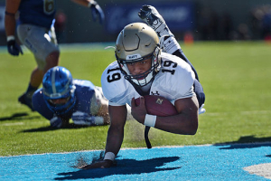 Navy quarterback Keenan Reynolds lands in the end zone for a touchdown against Air Force at the Air Force Academy in Colorado Springs, Colo. Oct. 4, 2014. <br/>Wikimedia Commons/EJ Herson