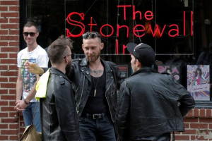 People gather outside the Stonewall Inn in the Greenwich Village neighborhood of New York City, May 9, 2016.  <br/>REUTERS/Brendan McDermid