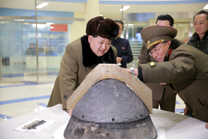 North Korean leader Kim Jong Un looks at a rocket warhead tip after a simulated test of atmospheric re-entry of a ballistic missile, at an unidentified location in this undated file photo released by North Korea's Korean Central News Agency (KCNA) in Pyongyang on March 15, 2016.  <br/>REUTERS/KCNA/File photo
