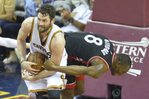 May 25, 2016; Cleveland, OH, USA; Cleveland Cavaliers forward Kevin Love (0) grabs a rebound against Toronto Raptors center Bismack Biyombo (8) in the second quarter in game five of the Eastern conference finals of the NBA Playoffs at Quicken Loans Arena.  <br/>David Richard-USA TODAY Sports