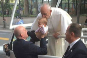 Pope Francis kisses Gianna Masciantonio.  <br/>Philly Voice
