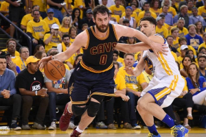 Oakland, CA, USA; Cleveland Cavaliers forward Kevin Love (0) moves the ball against Golden State Warriors guard Klay Thompson (11) during the first half in game one of the NBA Finals at Oracle Arena.  <br/>Kyle Terada-USA TODAY Sports