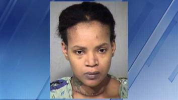A booking photo of Octavia Rogers shows a wound several inches long across her throat. <br/>Police