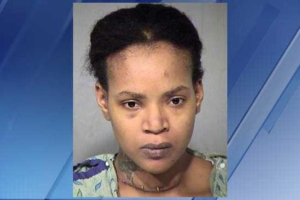 A booking photo of Octavia Rogers shows a wound several inches long across her throat. <br/>Police