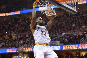 Cleveland, OH, USA; Cleveland Cavaliers forward LeBron James (23) dunks the ball in front of Golden State Warriors forward Draymond Green (23) during the four quarter in game three of the NBA Finals at Quicken Loans Arena. <br/>Ken Blaze-USA TODAY Sports