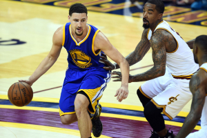 Cleveland, OH, USA; Golden State Warriors guard Klay Thompson (11) handles the ball against Cleveland Cavaliers guard J.R. Smith (5) during the fourth quarter in game three of the NBA Finals at Quicken Loans Arena.  <br/> Bob Donnan-USA TODAY Sports