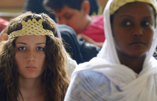 Young Coptic Orthodox Christians attend a Sunday mass in the Samaan el-Kharaz Monastery in the Mokattam Mountain area of Cairo. A wave of kidnappings, forced conversions and forced marriages of young Christian girls in Egypt, has Christian families living in fear, states International Christian Concern.  <br/>Reuters 