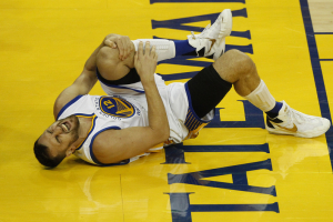 Oakland, CA, USA; Golden State Warriors center Andrew Bogut (12) reacts after suffering an apparent injury against Cleveland Cavaliers during the second half in game five of the NBA Finals at Oracle Arena.  <br/>Cary Edmondson-USA TODAY Sports