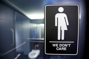 A sign protesting a recent North Carolina law restricting transgender bathroom access is seen in the bathroom stalls at the 21C Museum Hotel in Durham, North Carolina May 3, 2016.  <br/>REUTERS/Jonathan Drake/File photo
