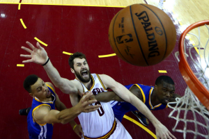 Cleveland, OH, USA; Cleveland Cavaliers forward Kevin Love (0) shoots the ball against Golden State Warriors guard Stephen Curry (30) in game six of the NBA Finals at Quicken Loans Arena. <br/>Ronald Martinez/Pool Photo via USA TODAY Sports