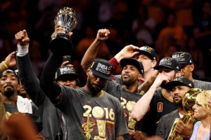 Oakland, CA, USA; Cleveland Cavaliers forward LeBron James (23) celebrates with the Bill Russell MVP Trophy after beating the Golden State Warriors in game seven of the NBA Finals at Oracle Arena.  <br/>Bob Donnan-USA TODAY Sports