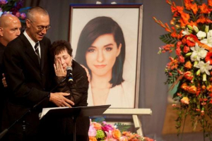 Tina Grimmie, mother of musician Christina Grimmie, is comforted by her husband Bud as Tina speaks during a memorial service held for the singer at Fellowship Alliance Chapel in Medford, New Jersey, U.S. June 17, 2016.<br />
 <br/>REUTERS/CHRIS LACHALL/COURIER-POST/POOL