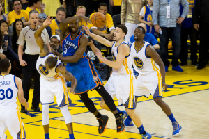 Oakland, CA, USA; Oklahoma City Thunder forward Serge Ibaka (9) passes the ball against Golden State Warriors forward Andre Iguodala (9) and guard Klay Thompson (11) during the fourth quarter in game seven of the Western conference finals of the NBA Playoffs at Oracle Arena.  <br/>Kelley L Cox-USA TODAY Sports