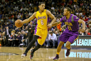 New Orleans, LA, USA; Los Angeles Lakers guard Jordan Clarkson (6) drives past New Orleans Pelicans guard Bryce Dejean-Jones (31) during the first quarter of a game at the Smoothie King Center.  <br/>Derick E. Hingle-USA TODAY Sports - RTX25J59
