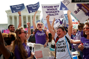 Demonstrators celebrate at the Supreme Court after the court struck down a Texas law imposing strict regulations on abortion doctors and facilities.  <br/>REUTERS/Kevin Lamarque