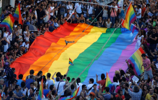 Gay rights activists carry a rainbow flag during a protest at Tunel Square in Istanbul.  <br/>REUTERS/Marko Djurica