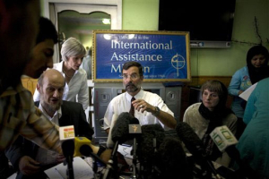 Dirk Frans, director of the International Assistance Mission, center, talks to a journalist during a press conference in Kabul, Afghanistan, Monday, Aug. 9, 2010. The Christian charity said Monday it had no plans to leave Afghanistan despite the murders of 10 members of its medical aid team and repeated that the organization does not attempt to convert Muslims to Christianity. <br/>AP Images / Rodrigo Abd