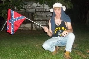 A photograph posted to a website with a racist manifesto shows Dylann Roof with a Confederate flag.  <br/>AP Photo