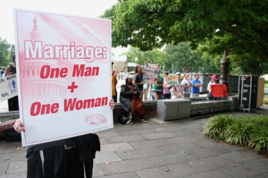 In this file photo, a traditional marriage supporter holds up a sign defending marriage as a union between a man and a woman during a rally in Washington, D.C., Aug. 15, 2010. <br/>The Christian Post
