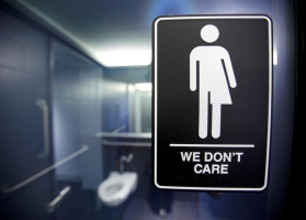 A sign protesting a recent North Carolina law restricting transgender bathroom access is seen in the bathroom stalls at the 21C Museum Hotel in Durham, North Carolina May 3, 2016.  <br/>REUTERS/Jonathan Drake/File Photo