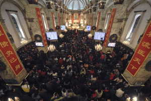 In this file photo, worshipers crowd a Catholic church for a Christmas Eve mass in Beijing, Thursday, Dec. 24, 2009. <br/>AP Photo / Andy Wong, File