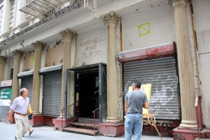 A pedestrian walks past the building on Park Place in Manhattan, N.Y., where Muslims plan to build a mosque and cultural center. <br/>The Christian Post
