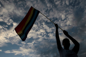 A participant holds up a rainbow flag during a gay pride parade in Managua, Nicaragua June 28, 2016.  <br/>REUTERS/Oswaldo Riva