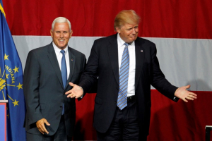 Republican U.S. presidential candidate Donald Trump (R) and Indiana Governor Mike Pence (L) wave to the crowd before addressing the crowd during a campaign stop at the Grand Park Events Center in Westfield, Indiana, July 12, 2016.  <br/>REUTERS/John Sommers II