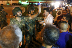 Turkish military discuss with people at the Taksim Square in Istanbul, Turkey, July 16, 2016. REUTERS/Murad Seze <br/>Reuters