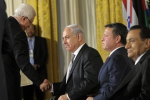 Palestinian President Mahmoud Abbas, left, shakes hands with Israel's Prime Minister Benjamin Netanyahu, as Jordan's King Abdullah II, second from right, and Egypt's President Hosni Mubarak, sit, during their statements in the East Room of the White House in Washington, Wednesday, Sept. 1, 2010. <br/>AP Images / Susan Walsh
