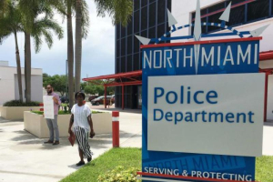 Miami resident Gabriel Pendas, 33, stands alone outside the North Miami police department after a press conference, which provided scant details regarding the police shooting of an unarmed, black behavioral therapist helping an autistic patient who escaped from his group home, in Miami, Florida, July 21, 2016.  <br/>REUTERS / Zachary Fagenson