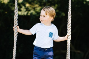 Prince George pictured on a swing at the family's country home <br/>Twitter