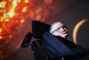 In this April 29, 2010, file photo, Stephen Hawking watches the first preview of his new show for the Discovery Channel, Stephen Hawking's Universe. <br/>AP Photo: / PA Wire, David Parry