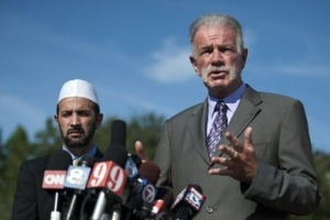Pastor Terry Jones of the Dove World Outreach Center speaks to the media as Imam Muhammad Musri of the Islamic Society of Central Florida looks on at left, Thursday, Sept. 9, 2010, in Gainesville, Fla.… Read more <br/>AP Photo / Phil Sandlin