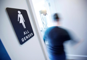 A bathroom sign welcomes both genders at the Cacao Cinnamon coffee shop in Durham, North Carolina, United States on May 3, 2016.  <br/>REUTERS/Jonathan Drake/File Photo