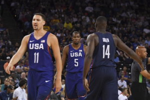 Oakland, CA, USA; USA guard Kevin Durant (5) is congratulated by forward Draymond Green (14) behind guard Klay Thompson (11) against China in the first quarter during an exhibition basketball game at Oracle Arena.  <br/>Kyle Terada-USA TODAY Sports