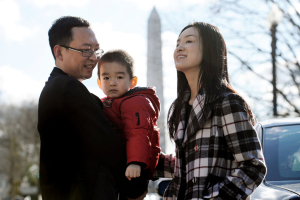 Best-selling Chinese author Yu Jie, his wife, Liu Min, and their son, Yu Guangyi, in Washington after China allowed them to leave. Living now in Fairfax, Va., Mr. Yu says he hopes to stay but sees his “lifelong goal as achieving democracy and freedom in China.” Despite rampant persecution carried out against Christians by China's Communist leaders, he has argued that Christianity - not Confucianism, Communism, or Atheism - is the country's future.   <br/>Cliff Owen/Associated Press
