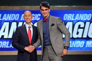 Brooklyn, NY, USA; Dario Saric (Croatia) shakes hands with NBA commissioner Adam Silver after being selected as the number twelve overall pick to the Orlando Magic in the 2014 NBA Draft at the Barclays Center.  <br/>Brad Penner-USA TODAY Sports