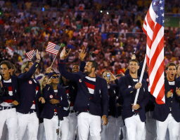 Flag-bearer Michael Phelps (USA) of United States of America takes part in the opening ceremony, leading the Team USA Olympic athletes into the Rio Olympics Stadium.  <br/>Reuters