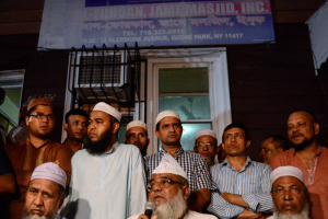 New York Muslim community members and religious leaders gather at the mosque of Imam Maulama Akonjee, who was shot to death along with an associate, on Saturday, Aug. 13, while walking nearby after prayers. Police are still searching for a lone suspect seen leaving the crime scene with a gun in his hand. <br/>Reuters / Stephanie Keith