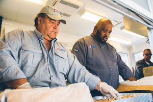 Mercy Chefs' founder and president, Gary LeBlanc (shown left in photo) and Chef Walter Taylor (on right) are on-site as of Aug. 15, 2016, in Baton Rouge, La., assisting wtih feeding 7,500 displaced residents, volunteers and first responders affected by disatrous levels of flooding. <br/>Mercy Chefs