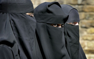 Women wear niqabs. <br/>Reuters