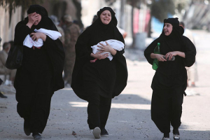 Women carrying newborn babies look relieved after Syrian Democratic Forces rescued them and 2,000 other hostages who reportedly were being used as human shields by retreating ISIL fighters leaving Manbij after 10 weeks of fighting. <br/>Reuters