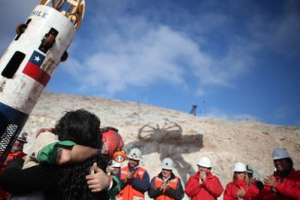 In this photo released by the Chilean government, miner Alex Vega, left, hugs his wife after being rescued from the collapsed San Jose gold and copper mine where he had been trapped with 32 other miners for over two months near Copiapo, Chile, Wednesday Oct. 13, 2010. <br/>AP Images / Hugo Infante, Chilean government