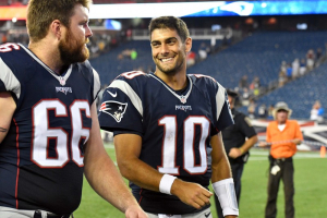 Aug 11, 2016; Foxborough, MA, USA; New England Patriots quarterback Jimmy Garoppolo (10) and center Bryan Stork (66) walk off of the field after a preseason NFL game at Gillette Stadium. The Patriots won 34-22.  <br/>Brian Fluharty-USA TODAY Sports