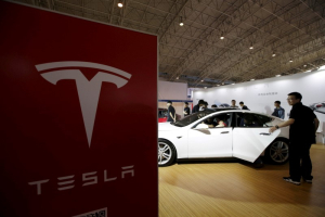 People visit a Tesla Model S car during the Auto China 2016 in Beijing, China, April 25, 2016. REUTERS/Jason Lee/File Photo <br/>