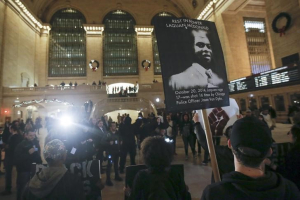 Black Lives Matter protesters chant slogans in Grand Central Terminal as they protest the 2014 death of Laquan McDonald from Chicago in the Manhattan borough of New York December 14, 2015.  <br/>REUTERS/Carlo Allegri