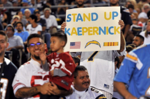 Sep 1, 2016; San Diego, CA, USA; A San Diego Chargers fan holds up a sign in reference to San Francisco 49ers quarterback Colin Kaepernick (not pictured) during the first half of the game at Qualcomm Stadium. Mandatory Credit: Orlando Ramirez-USA TODAY Sports <br/>