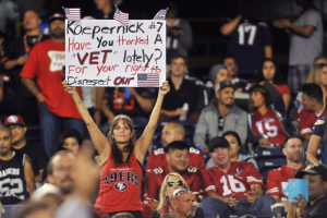 Sep 1, 2016; San Diego, CA, USA; A San Francisco 49ers fan holds up a sign in reference to quarterback Colin Kaepernick (not pictured) during the second half of the game against the San Diego Chargers at Qualcomm Stadium. San Francisco won 31-21. Mandatory Credit: Orlando Ramirez-USA TODAY Sports <br/>