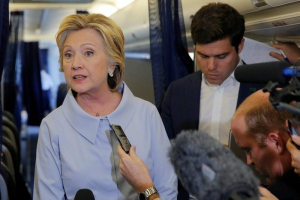 U.S. Democratic presidential candidate Hillary Clinton answers questions from reporters on her campaign plane enroute to a campaign stop in Moline, Illinois, United States September 5, 2016.  <br/>REUTERS/Brian Snyder